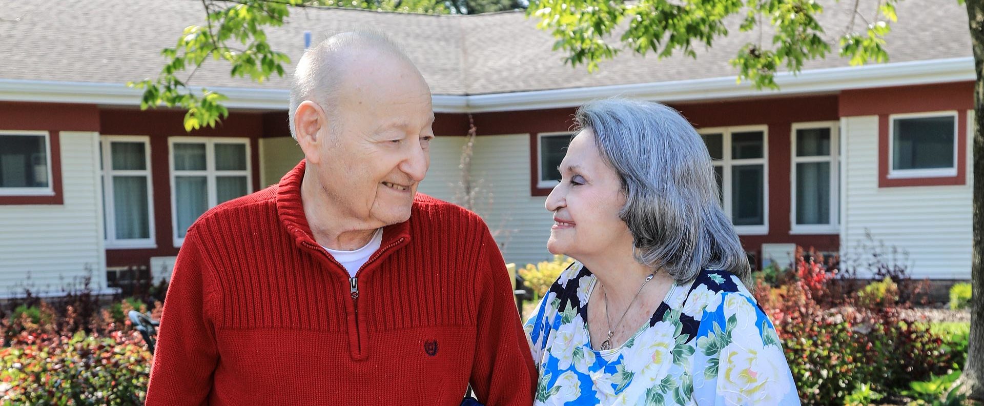 Elderly couple smiling with each other